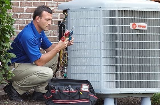 AC Tech working on a unit
